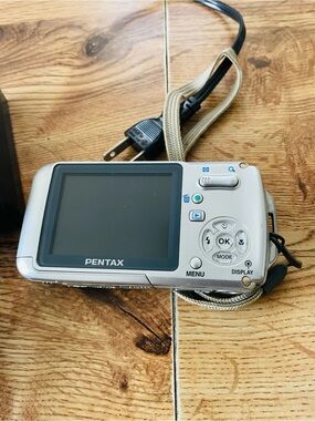Pentax silver digital point-and-shoot camera